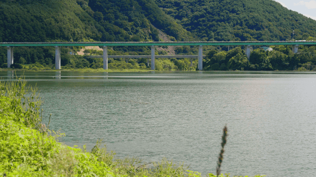 Bridge stretching across a quiet lake
