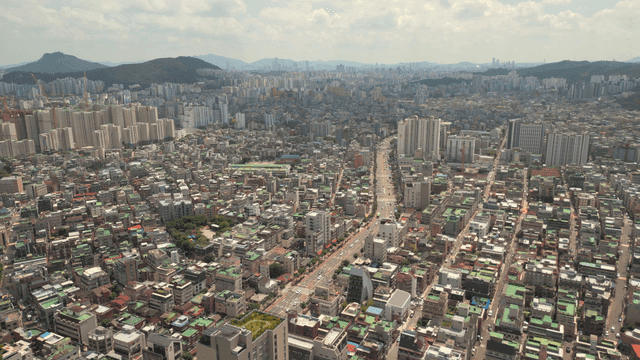 Vast cityscape with wide road in middle