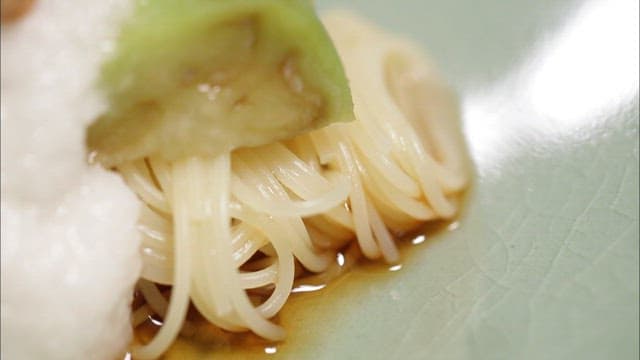 Close-up of a noodle dish with natto and grated yam