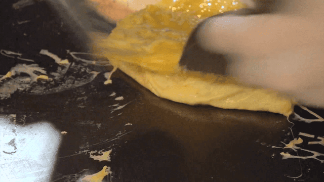Shaping on hot griddle egg omelette