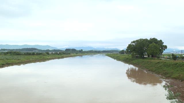 Serene River Landscape on Overcast Day