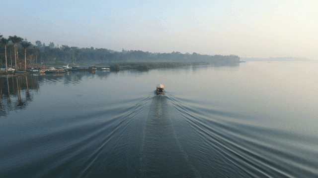 Boat sailing on a calm river