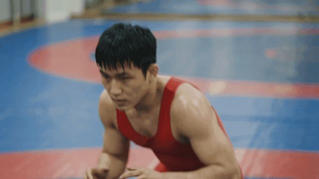 Wrestler wearing red singlet