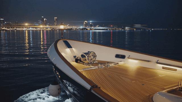 Yachts on quiet night sea with night lights