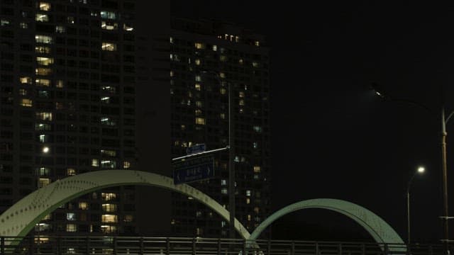 Night View of Urban Bridge and Apartments