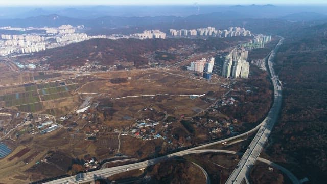 Highway Passing Next to a Residential City