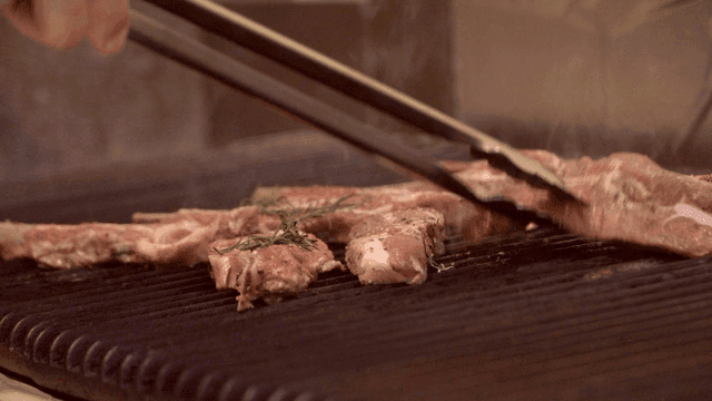 Lamb chops grilling with rosemary