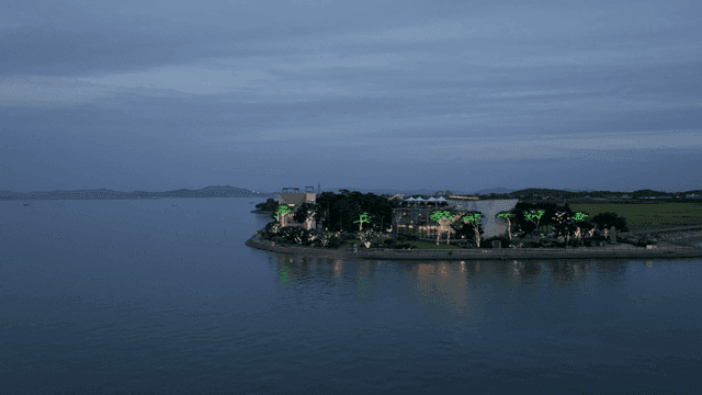 Coastal building lit up at night