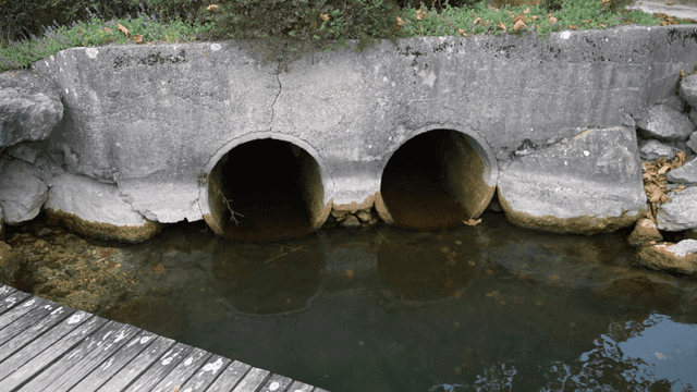 Concrete drainage pipes by a river