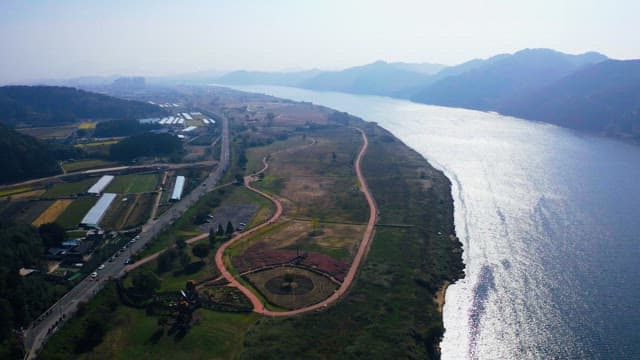 Serene View of a winding river and lush park on a sunny day