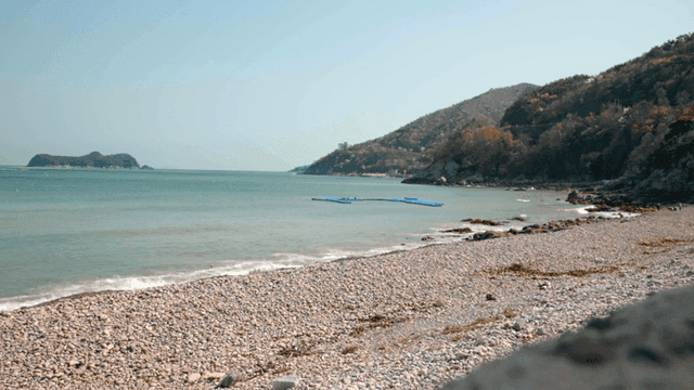 Quiet beach with distant island views
