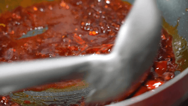 Mala sauce boiling in pan
