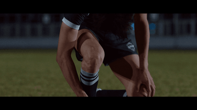 Soccer player collapses on field at night