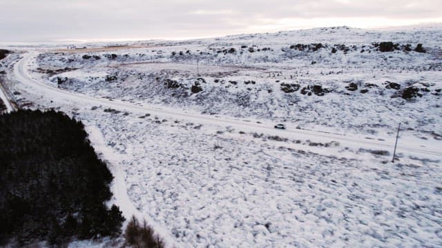 Car driving on a snowy road