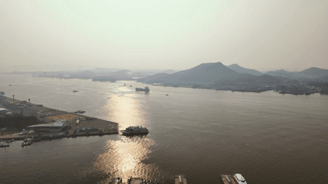 Serene port with distant mountains