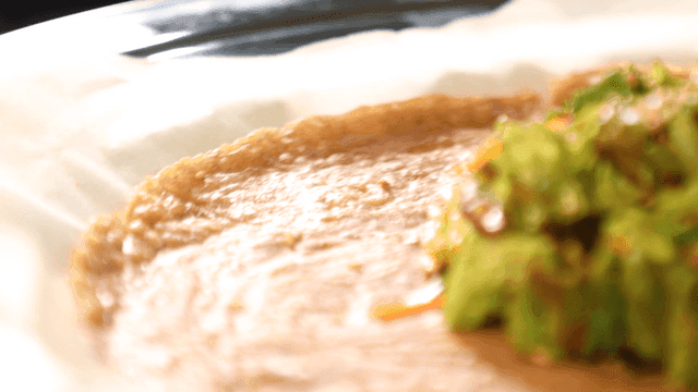 Buckwheat pancake topped with fresh seasoning served on plate