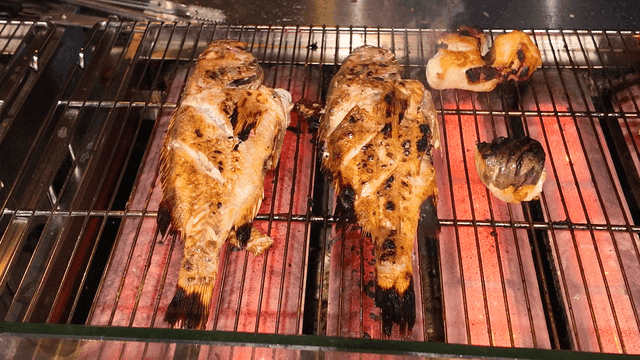 Grilled fish on hot grill