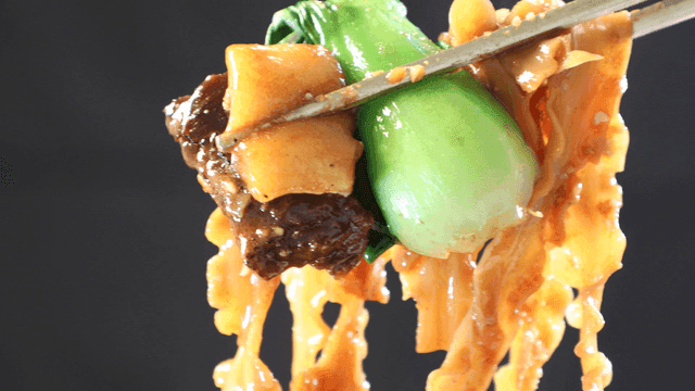 Chopsticks holding stir-fried noodles