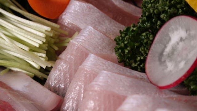 Freshly sliced yellow tail sashimi on a plate