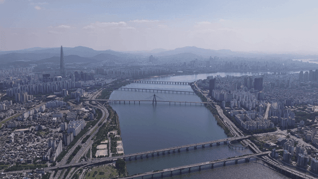 Aerial view of a city with a river and bridges