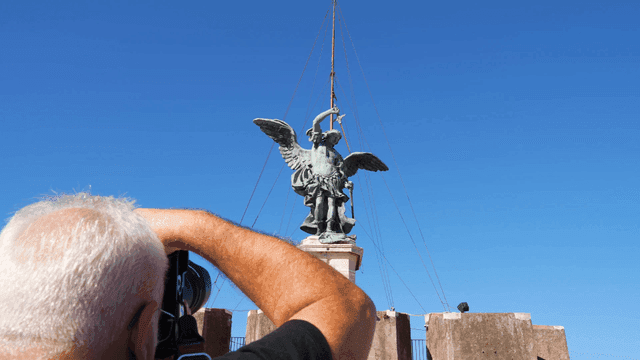 Tourists taking pictures of famous angel statue