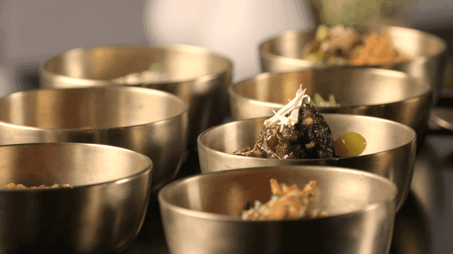 Korean side dishes in brass bowls