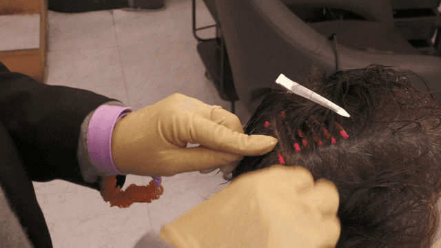 Hairdresser who does elaborate perms