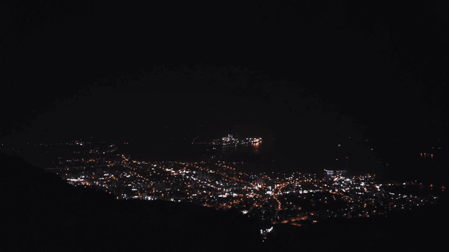 City illuminated at night from a distance