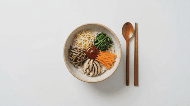 Bowl of bibimbap filled with various vegetables
