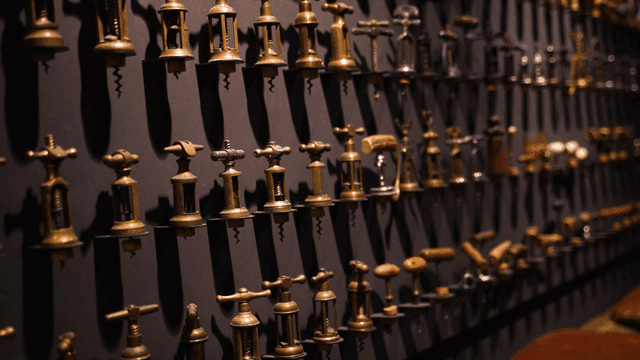 Collection of vintage corkscrews on display