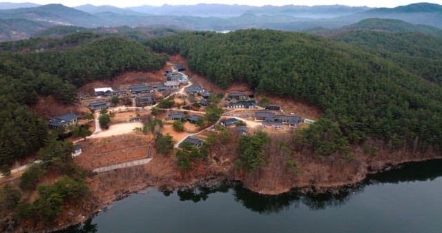 Aerial View of Traditional Village by the Lake