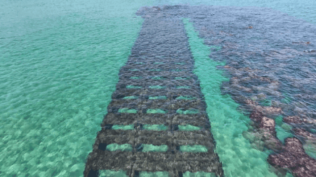Clear turquoise sea with underwater structures