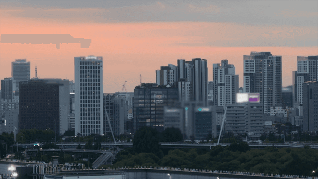 Sunset over a modern city skyline