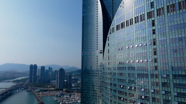High-rise building with a unique and modern appearance under a sunny sky