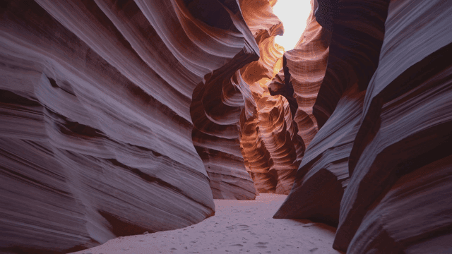 Sunlit, winding sandstone canyon