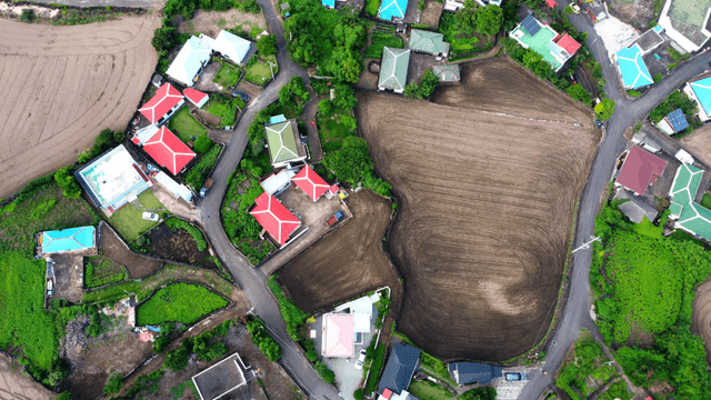 Aerial view of rural village and farmland