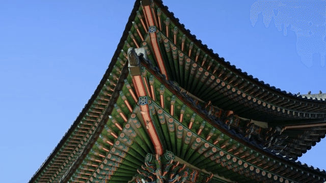 Traditional Korean Roof Under Blue Sky