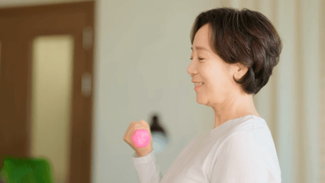 Woman exercising with a dumbbell
