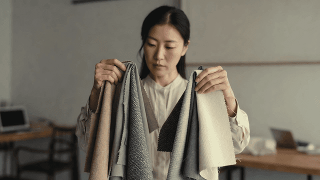 Woman examining fabric samples