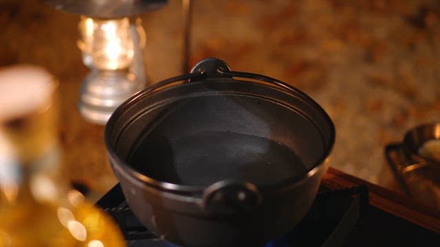 Preparing a Mussel Soup in a Pot