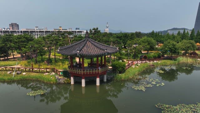 Serene pond with a traditional pavilion