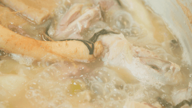 Ginseng chicken soup boiling in a pot