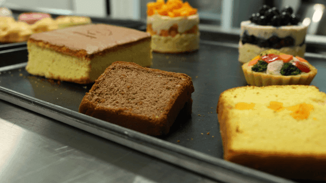 Various desserts on a tray in a kitchen