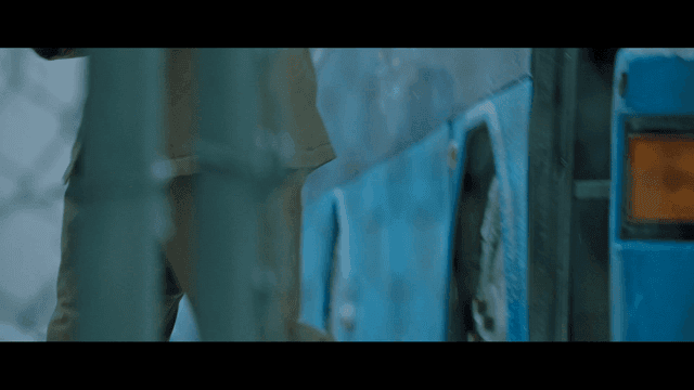 Prisoners getting off blue bus in winter