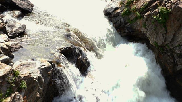 Water of a valley that quickly falls from top to bottom