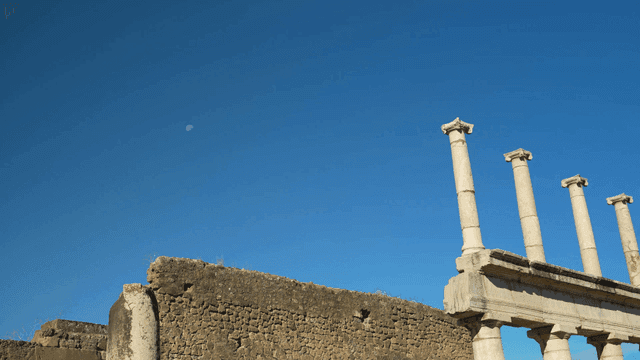 Ancient ruins with stone columns under a clear sky