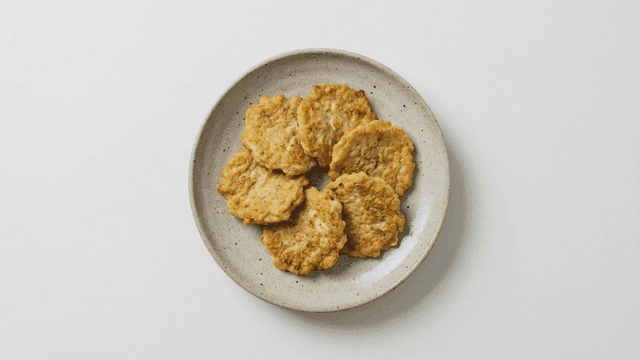 Enoki mushroom pancakes neatly arranged on plate