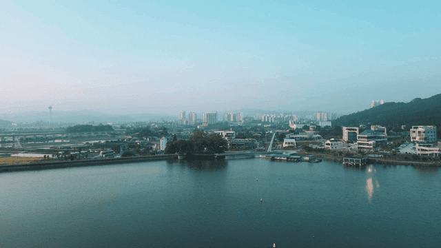 Cityscape with river and buildings.