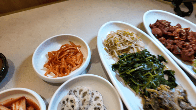 Various Korean side dishes on a table
