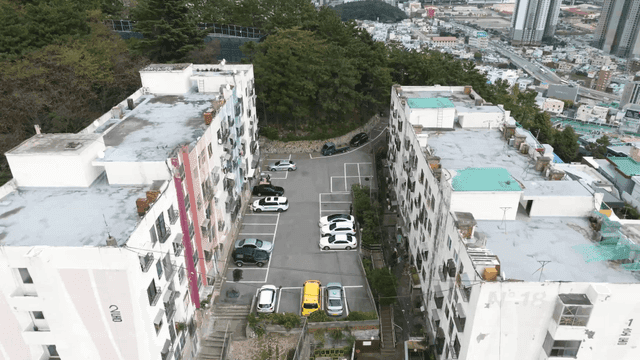Small apartment buildings and surrounding green space